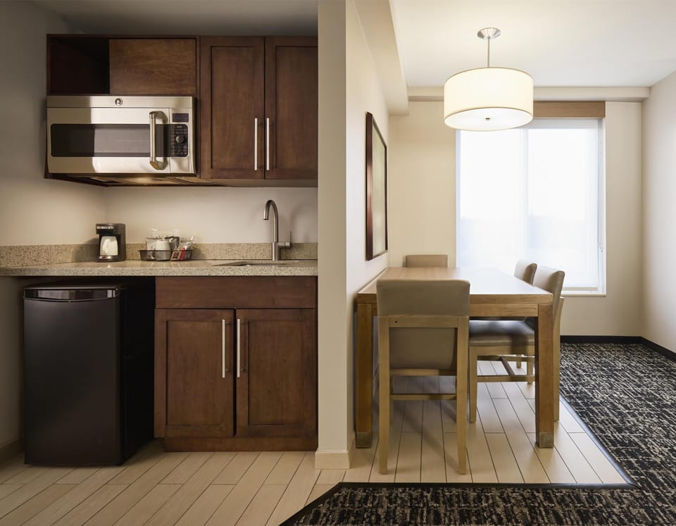 Suite, 1 King Bed | Private kitchen | Mini-fridge, microwave, coffee/tea maker