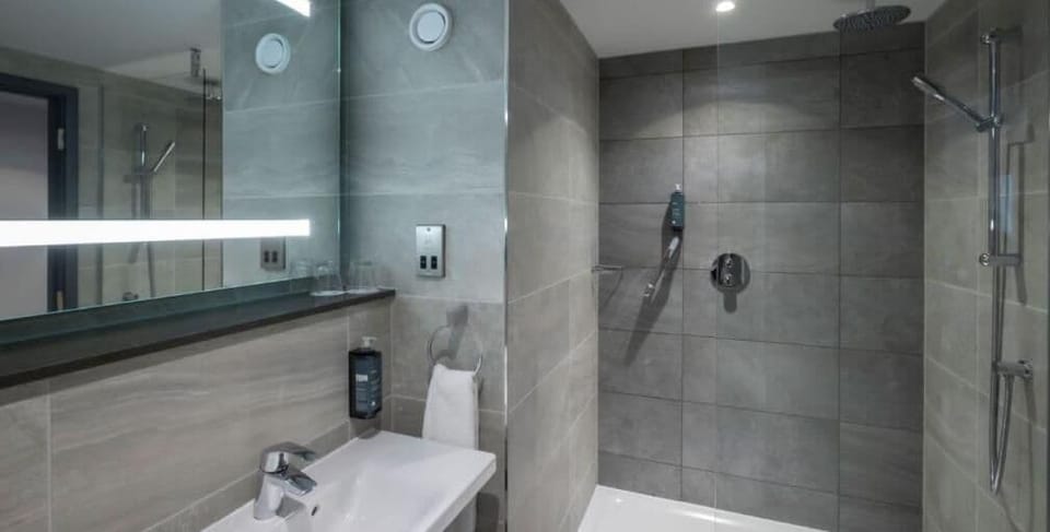 Shower, rainfall showerhead, hair dryer, towels