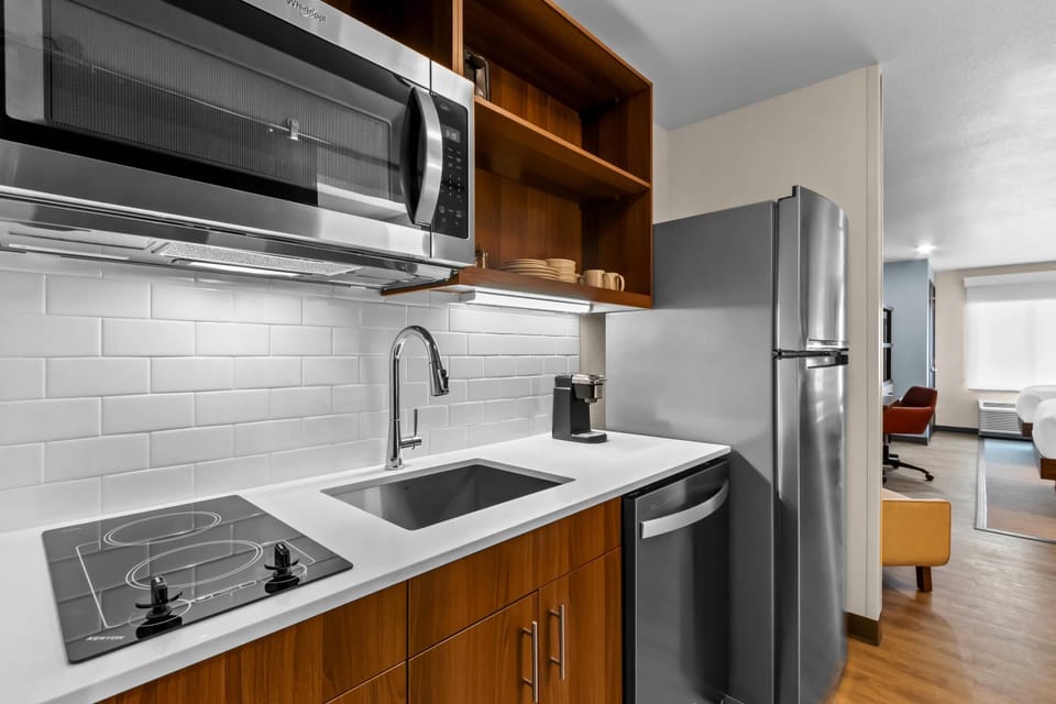 Suite, 2 Queen Beds, Non Smoking | Private kitchen | Fridge, microwave, stovetop, dishwasher