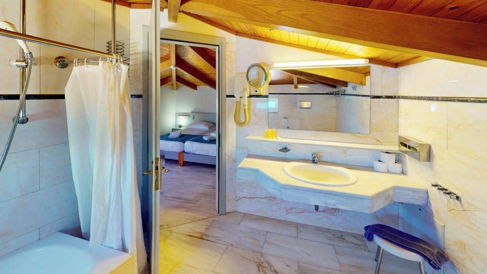 Family Apartment, 1 Bedroom, Courtyard Area | Bathroom | Hair dryer, bathrobes, towels, soap