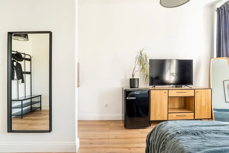 City Apartment | Living area | 34-inch Smart TV with cable channels, Netflix, streaming services