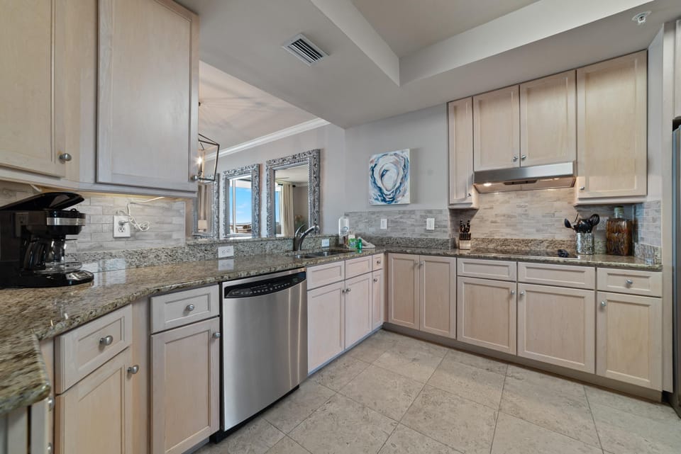 Condo, Multiple Beds (Indigo East 604) | Private kitchen | Oven, toaster, paper towels