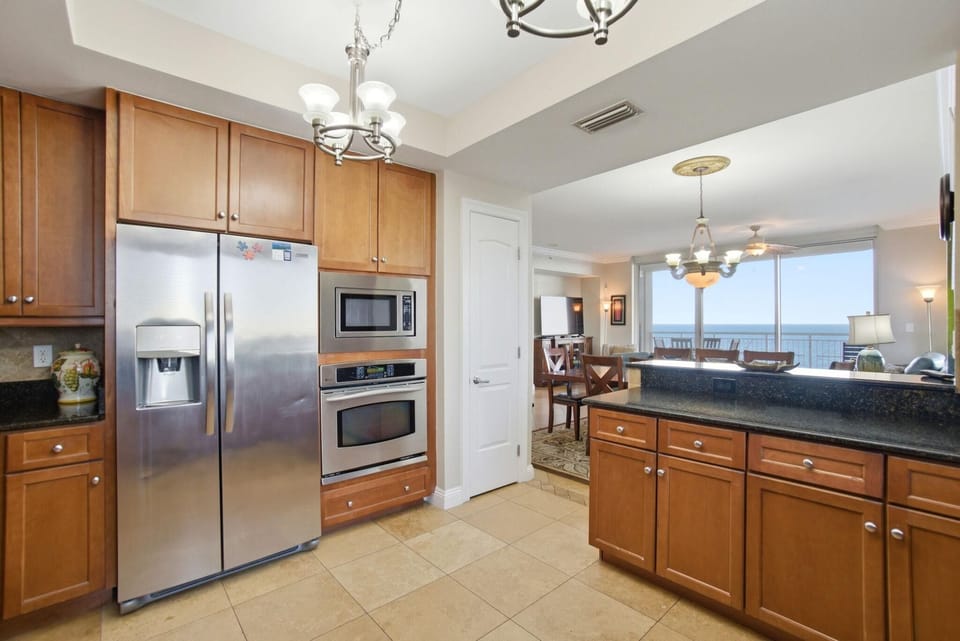 Condo, Multiple Beds (Indigo East 906) | Private kitchen | Oven, toaster, paper towels