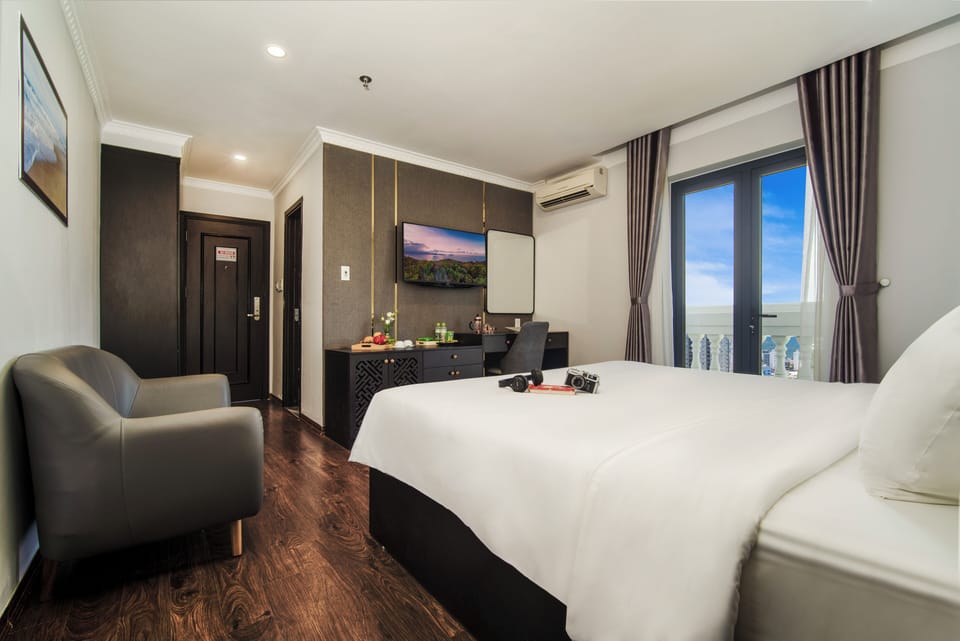 Deluxe Double Room, Balcony, City View | Minibar, in-room safe, desk, blackout drapes