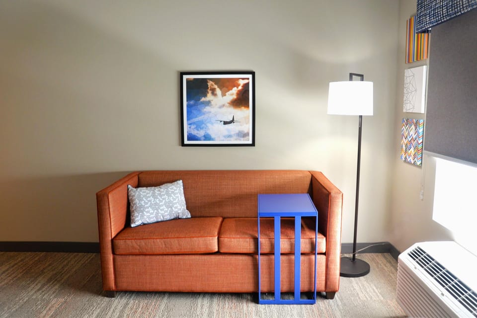 Room, 1 King Bed, Refrigerator & Microwave | Living area | 50-inch LED TV with digital channels