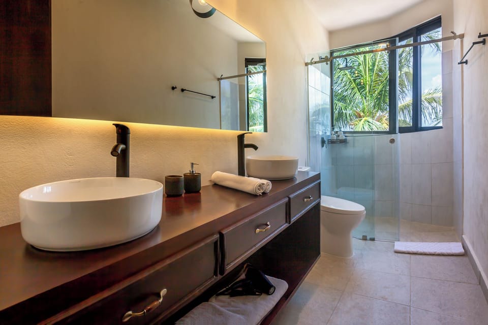 Panoramic Suite, 2 Bedrooms, Sea View, Beachfront | Bathroom | Shower, free toiletries, hair dryer, towels