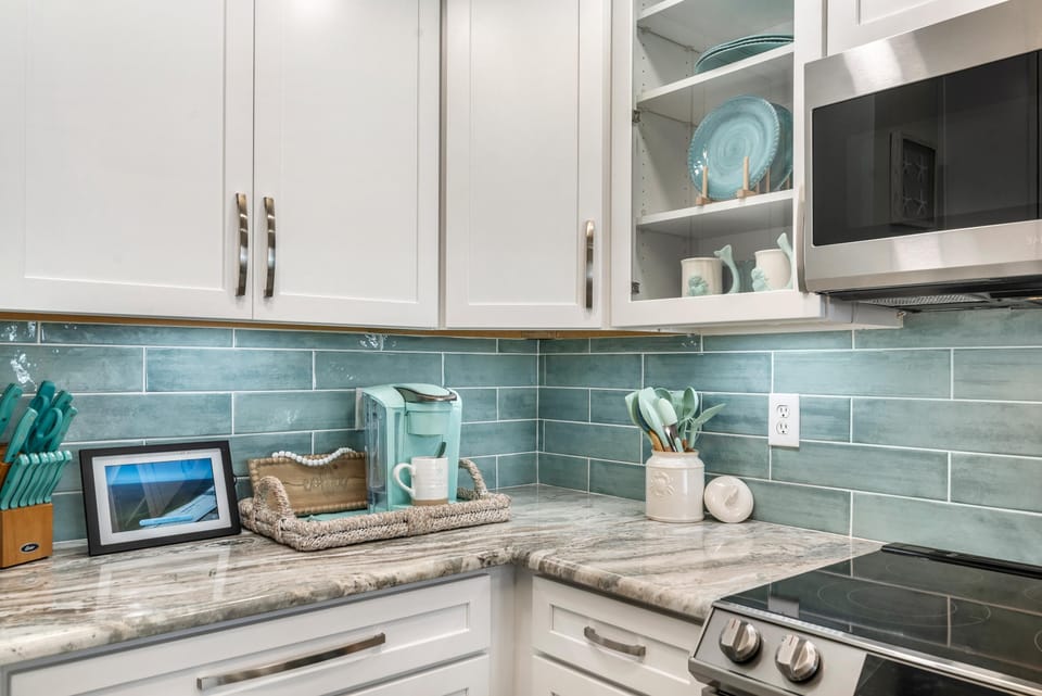 Condo, Multiple Beds (Indigo East 303) | Private kitchen | Oven, toaster, paper towels