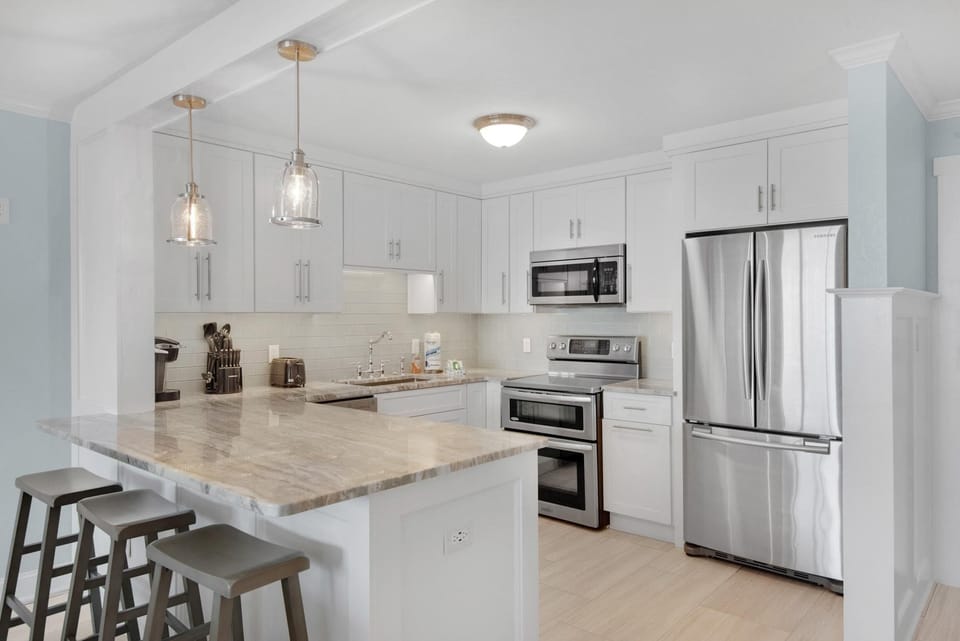 Condo, Multiple Beds (Dolphin Point 404C) | Private kitchen | Oven, toaster