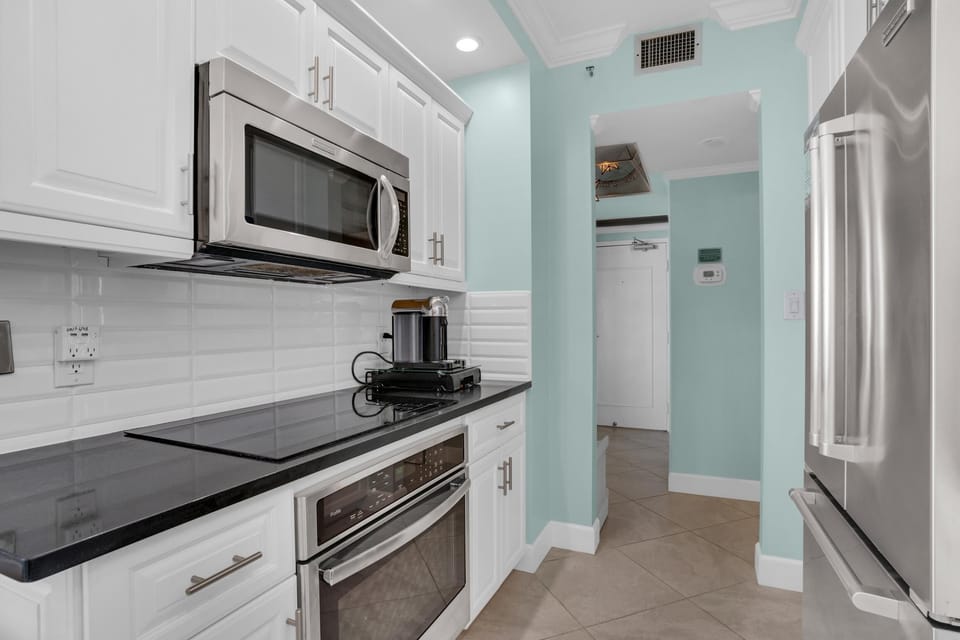 Condo, 1 King Bed with Sofa bed (Surfside Resort #403) | Private kitchen | Oven, toaster