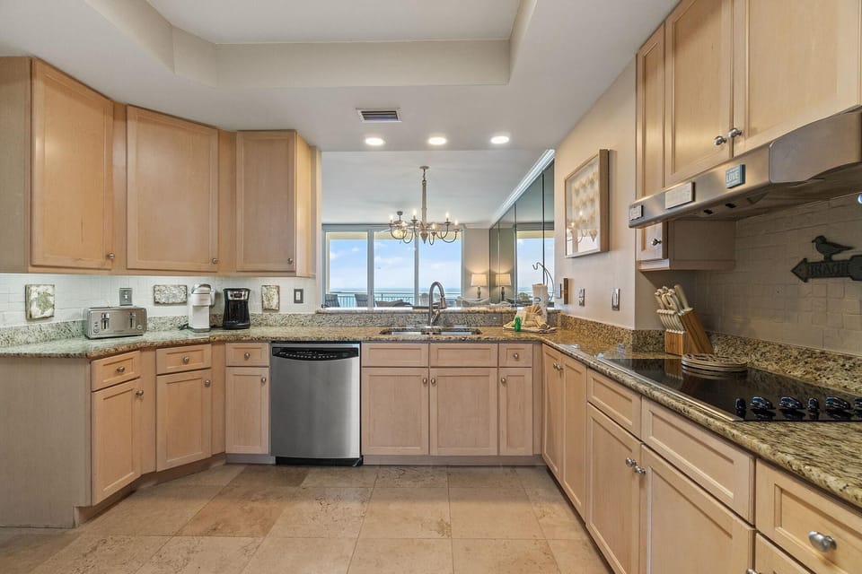 Condo, Multiple Beds (Indigo East 1004) | Private kitchen | Oven, toaster, paper towels