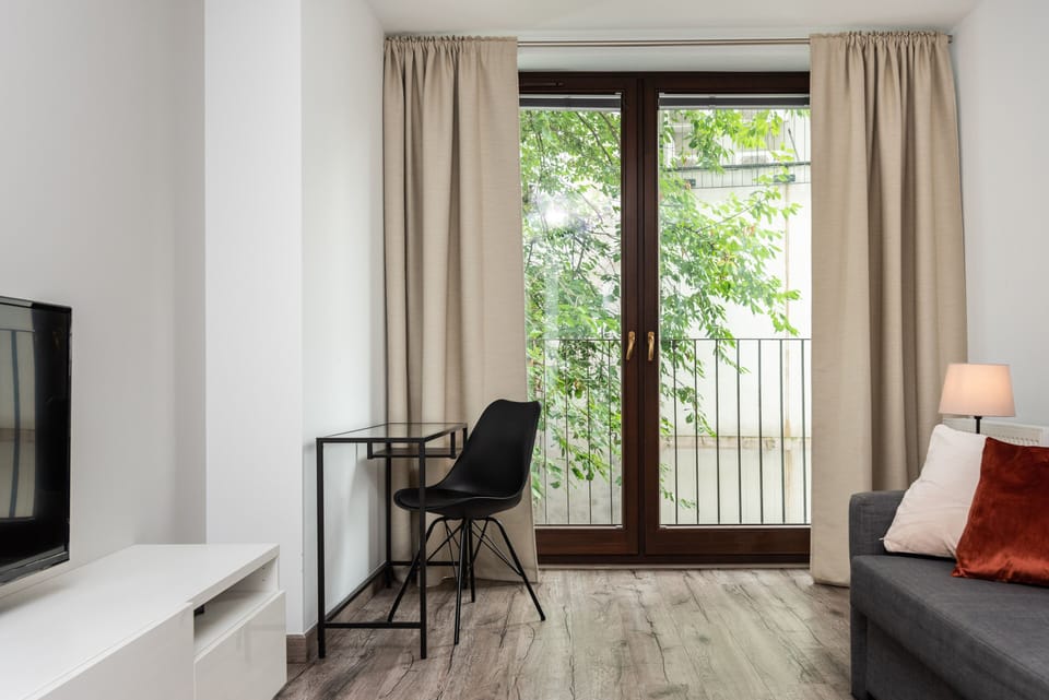 7. Blossom - Old Town Residence | Living area | Flat-screen TV