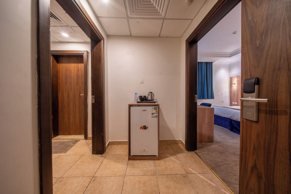 Two-Bedroom Suite | Living area | 39-inch Smart TV with cable channels
