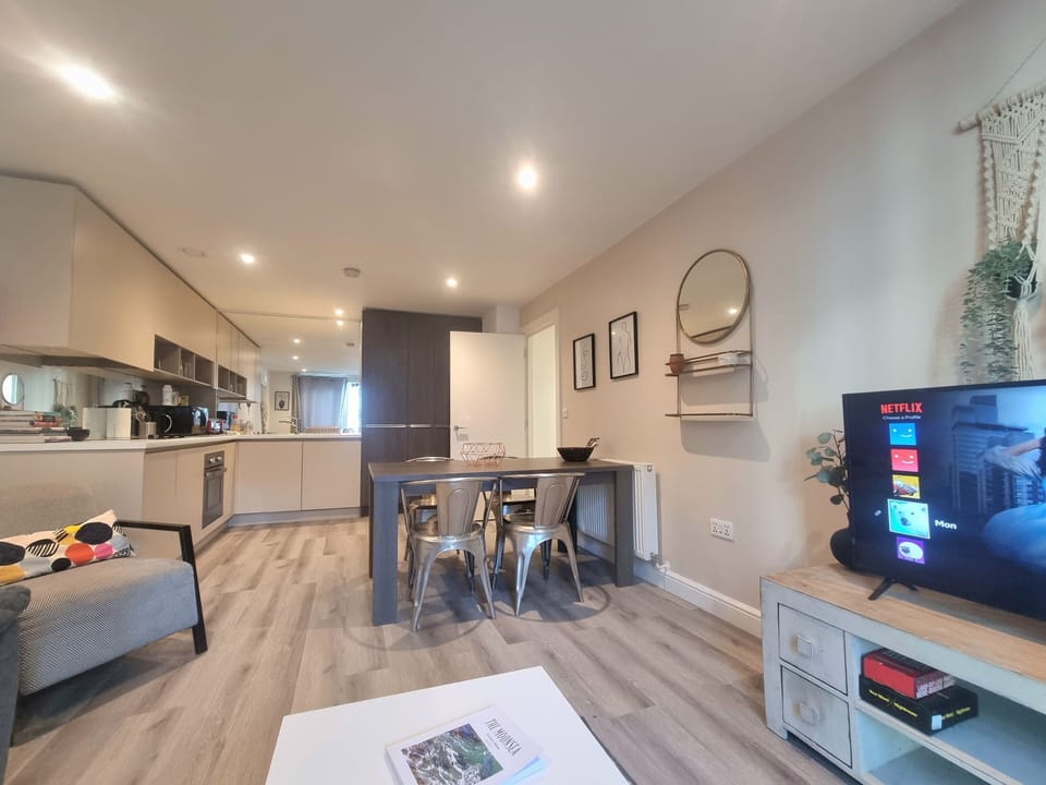 City Apartment | Living area | 50-inch Smart TV with digital channels
