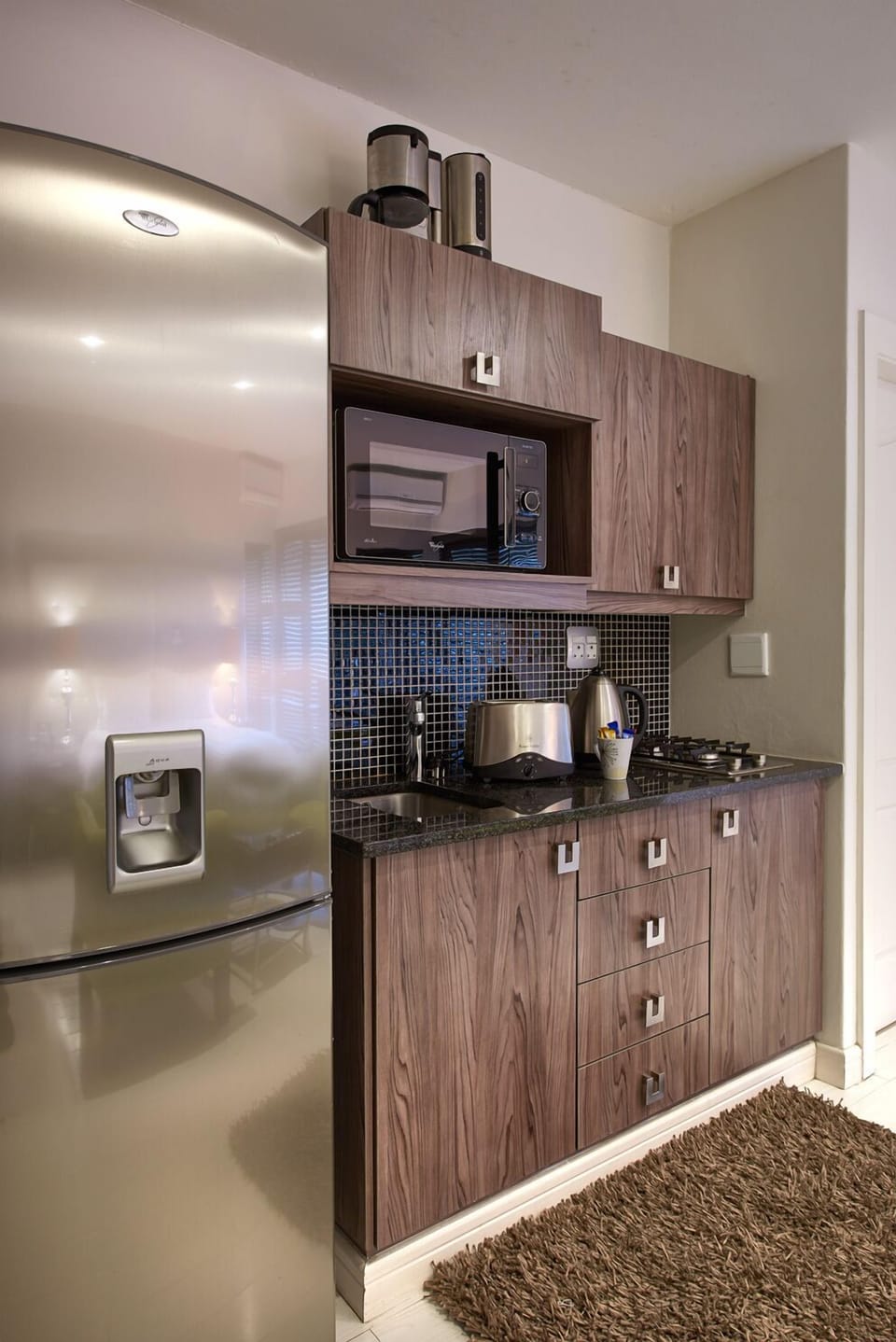 Luxury Room, 1 Bedroom, Refrigerator & Microwave, River View | Private kitchenette | Full-size fridge, microwave, oven, stovetop