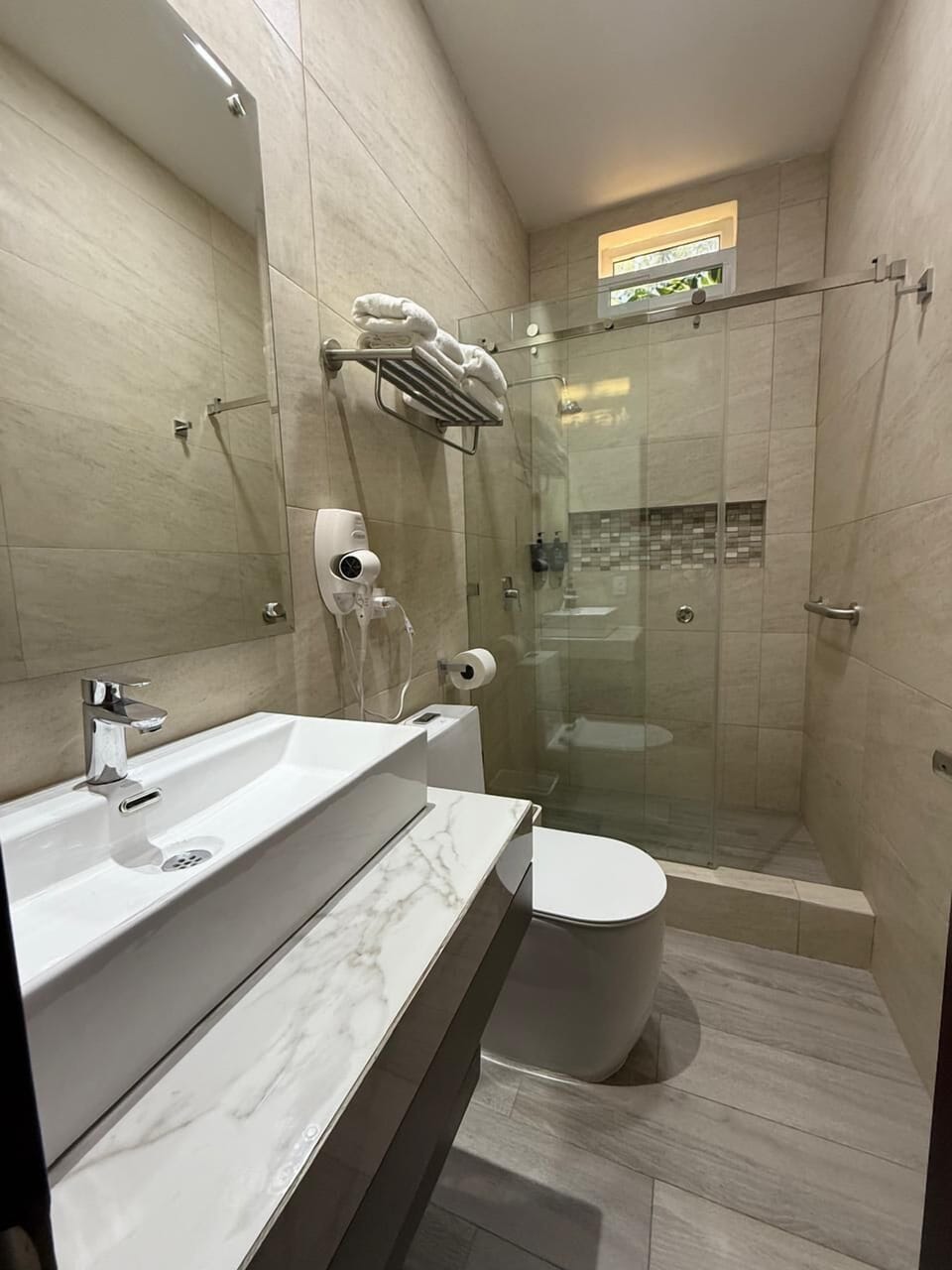 Family Room | Bathroom | Shower, rainfall showerhead, hair dryer, towels
