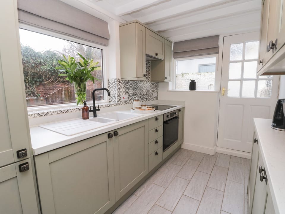 Fridge, electric kettle, cookware/dishes/utensils
