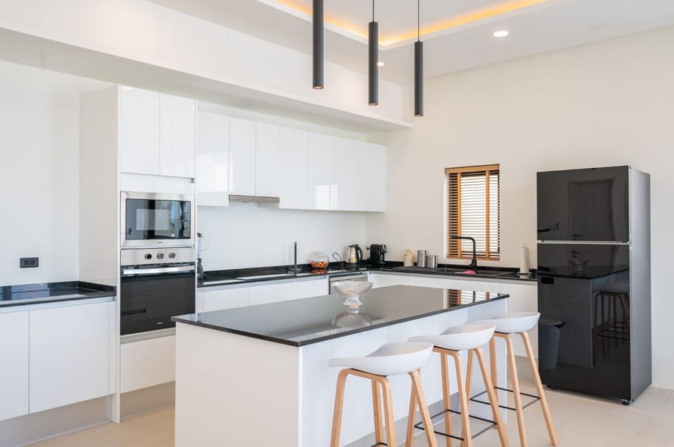 Exclusive Villa | Private kitchen | Full-size fridge, microwave, oven, stovetop