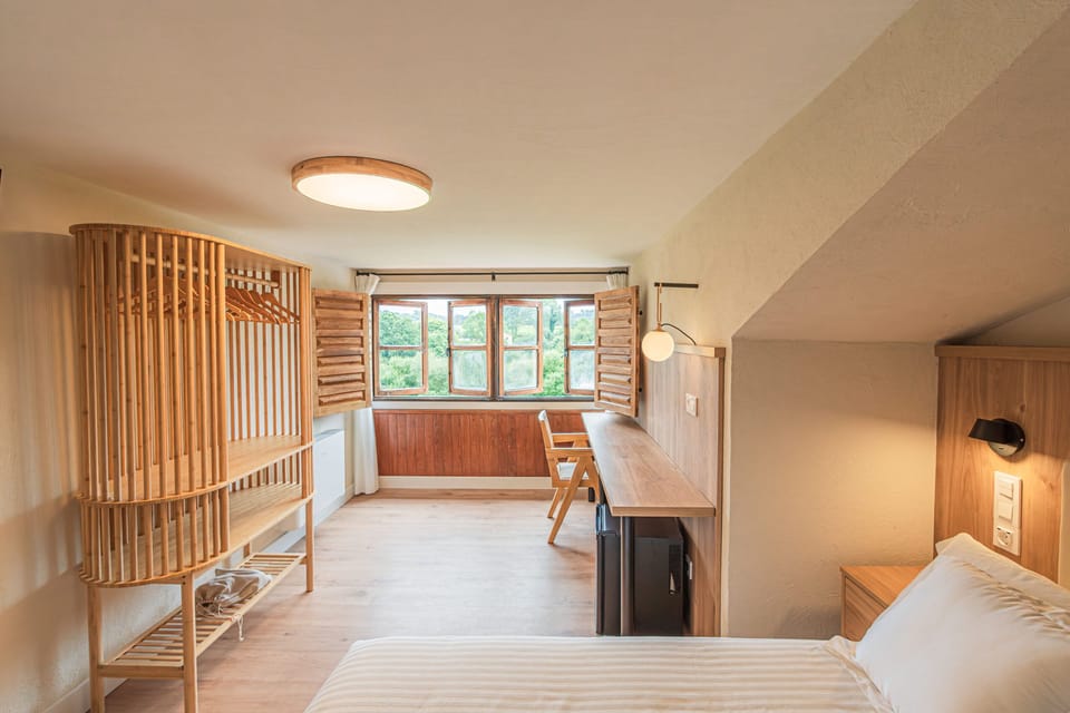 Deluxe Quadruple Room, City View | Desk, laptop workspace, soundproofing, free WiFi