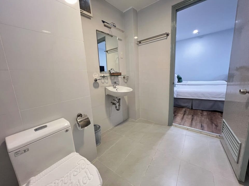 Standard Twin Room, No Windows | Bathroom | Free toiletries, hair dryer, slippers, towels