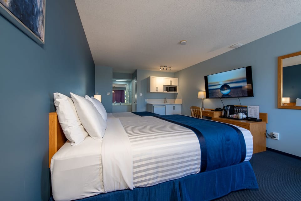 Deluxe Room, Multiple Beds, Kitchenette | Desk, laptop workspace, blackout drapes, iron/ironing board