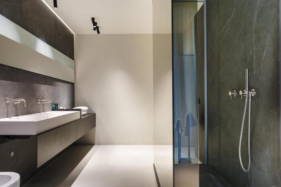 Superior Room | Bathroom | Shower, rainfall showerhead, designer toiletries, hair dryer