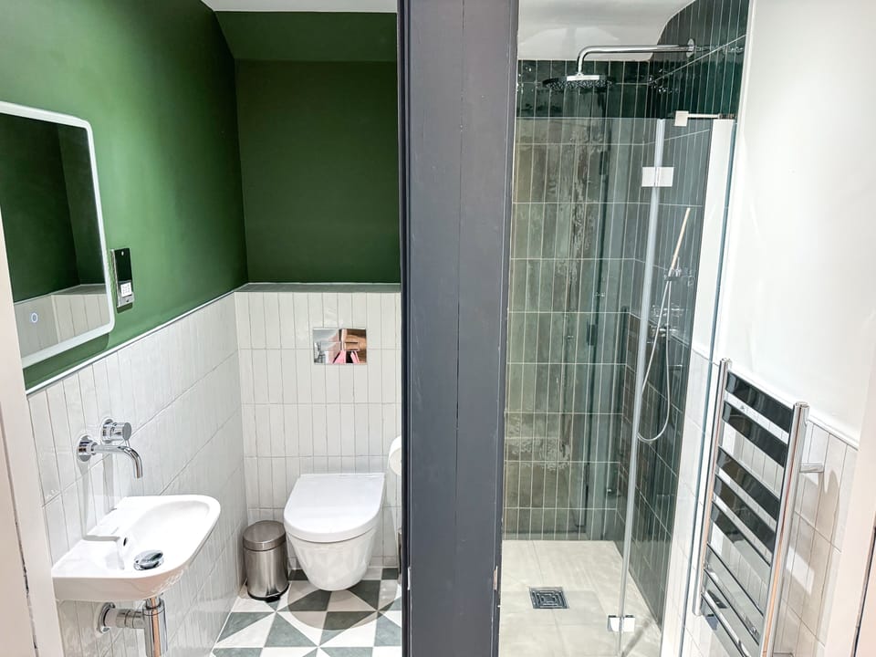 Shower, rainfall showerhead, towels, soap
