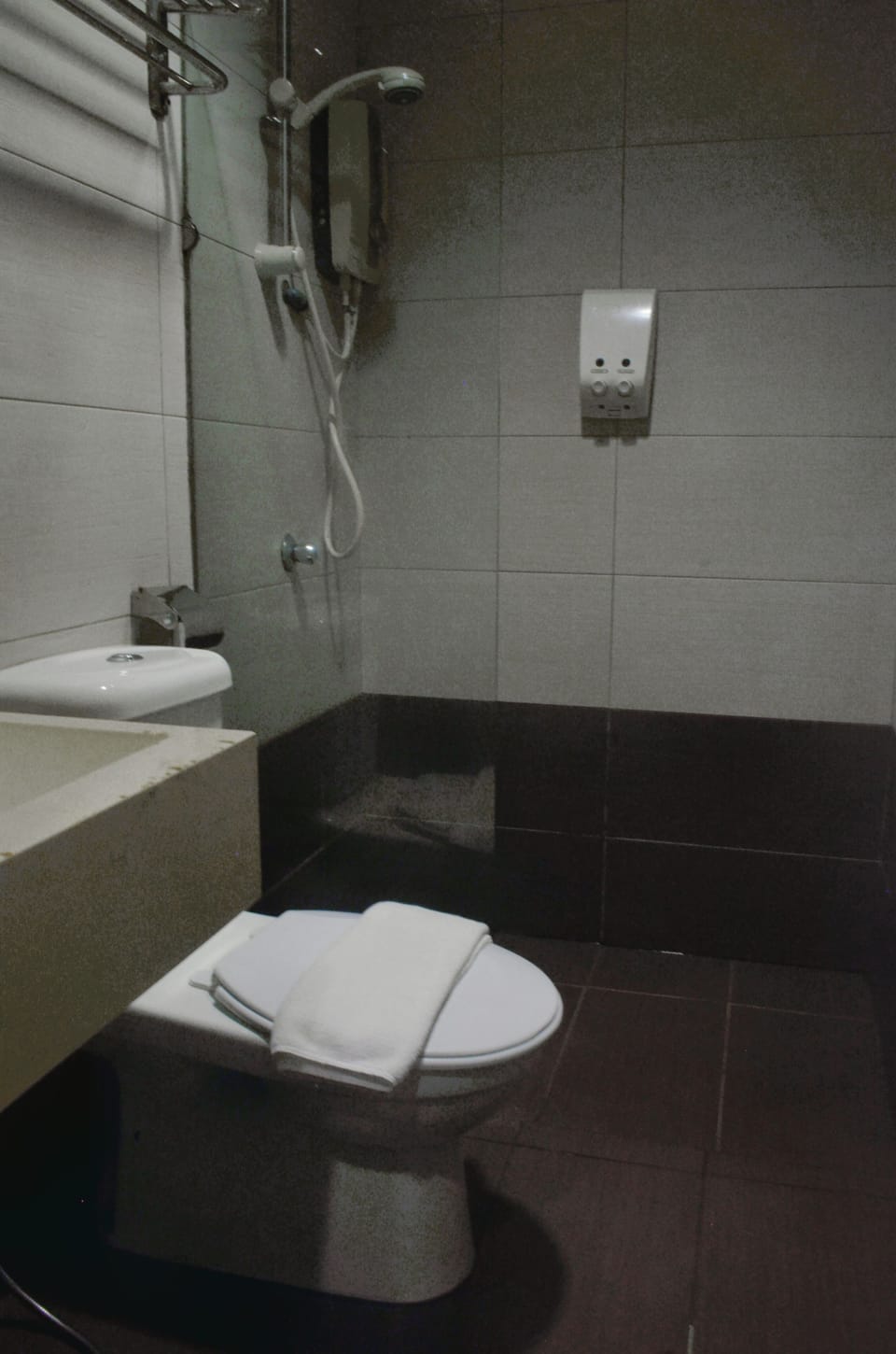 Shower, rainfall showerhead, hair dryer, towels