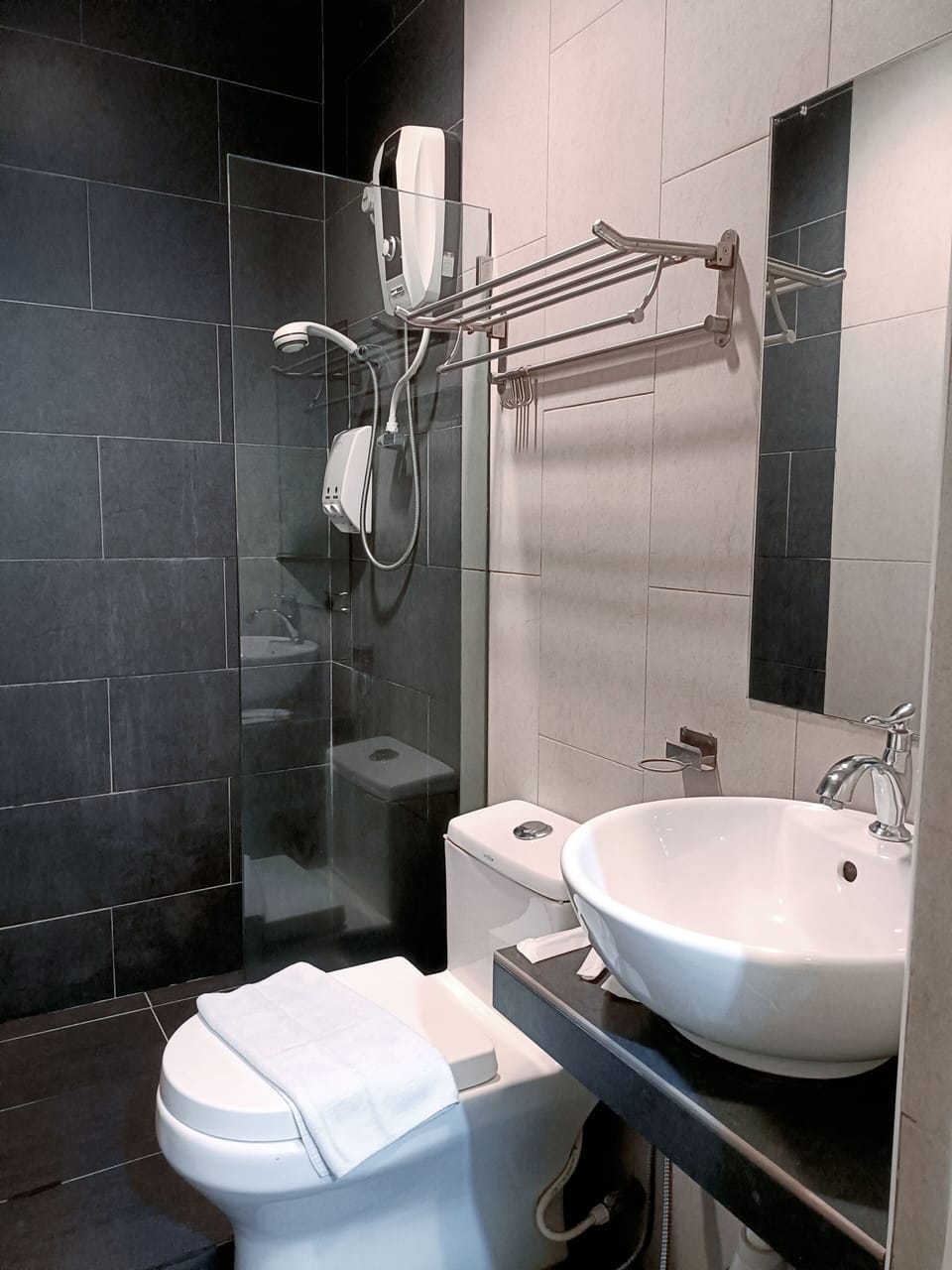 Shower, rainfall showerhead, hair dryer, towels