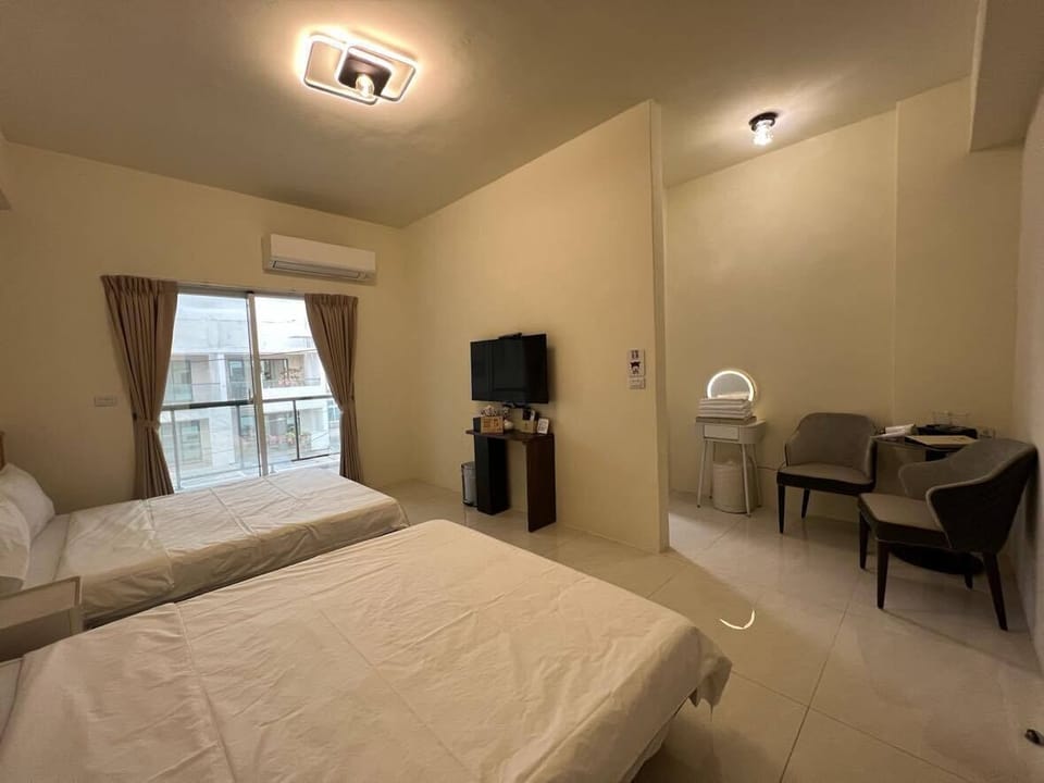 Deluxe Quadruple Room, Terrace, City View | Pillowtop beds, desk, laptop workspace, free WiFi