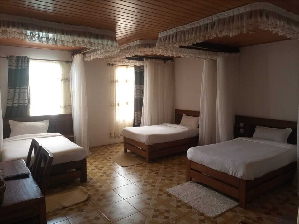 Family Triple Room | Desk, laptop workspace, iron/ironing board, free WiFi