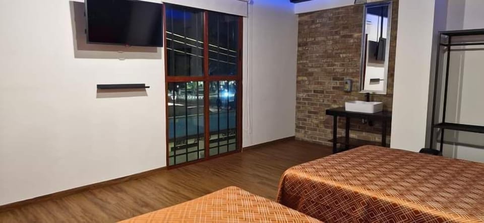 Business Quadruple Room, City View | Down comforters, Select Comfort beds, soundproofing, WiFi (free)