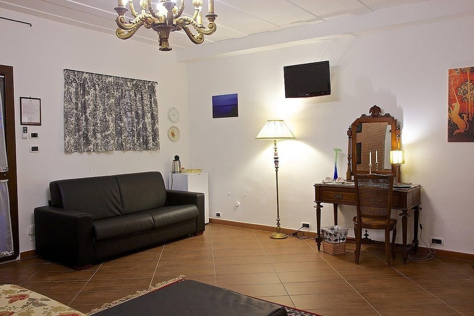 Quadruple Room | Living area | Fireplace
