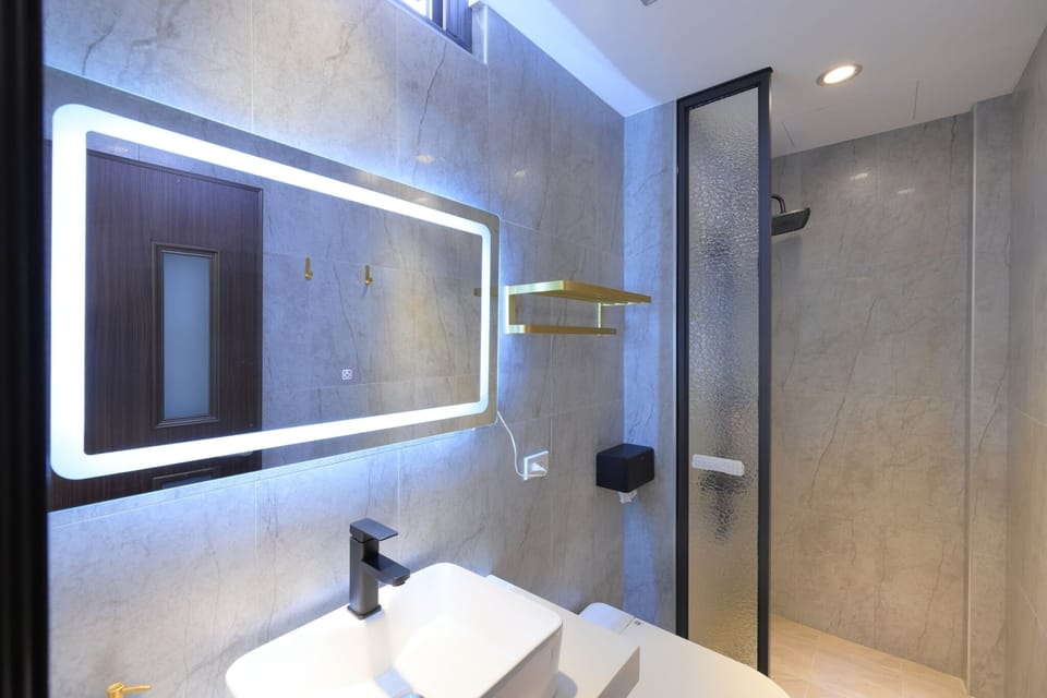 Standard Double Room | Bathroom | Rainfall showerhead, hair dryer, slippers, towels