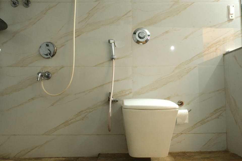Deluxe Pool View Room | Bathroom | Shower, bidet, towels, soap
