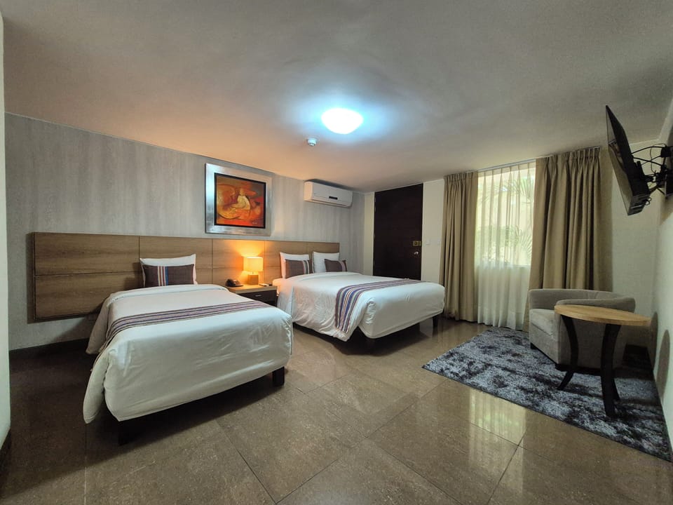 Family Triple Room | Down comforters, in-room safe, desk, laptop workspace