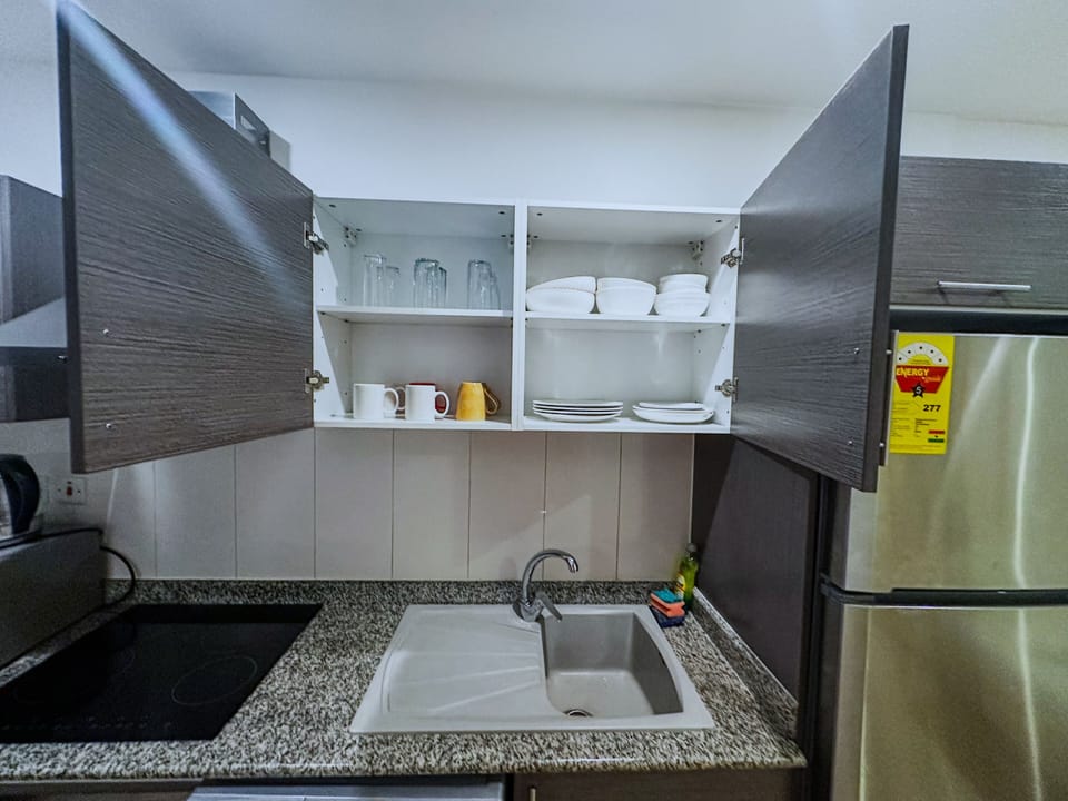 Luxury Studio | Private kitchen | Full-size fridge, microwave, oven, stovetop