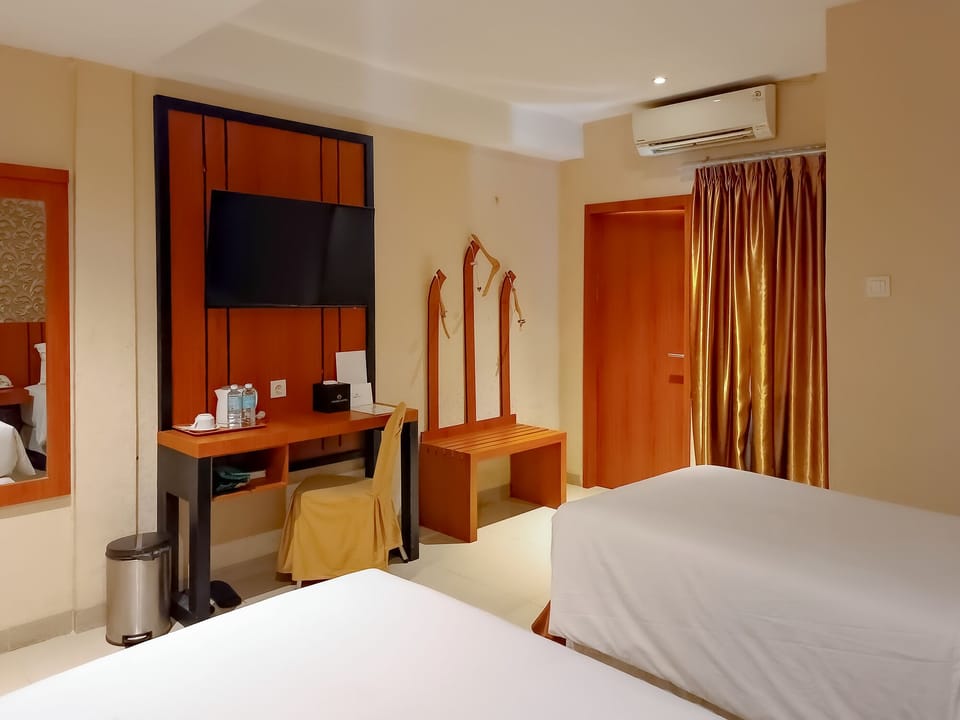 Standard Twin Room | Living area | Flat-screen TV