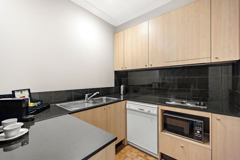 Executive Two Bedroom Apartment | Private kitchen | Fridge, microwave, stovetop, electric kettle