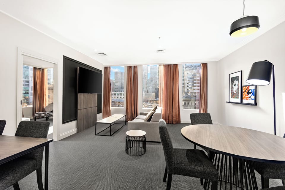 Executive Two Bedroom Apartment | Living area | 65-inch LED TV with cable channels