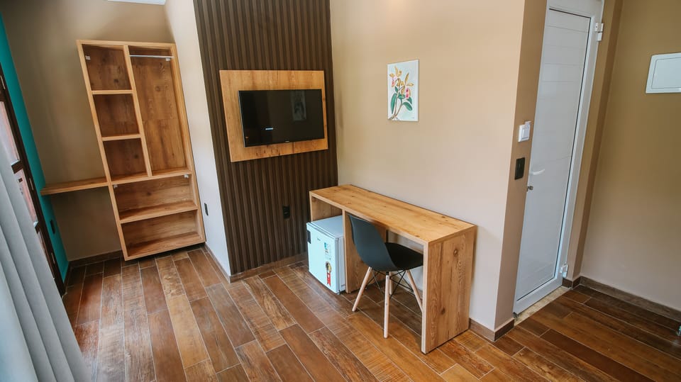 Superior Double Room, Patio | Minibar, individually decorated, desk, laptop workspace