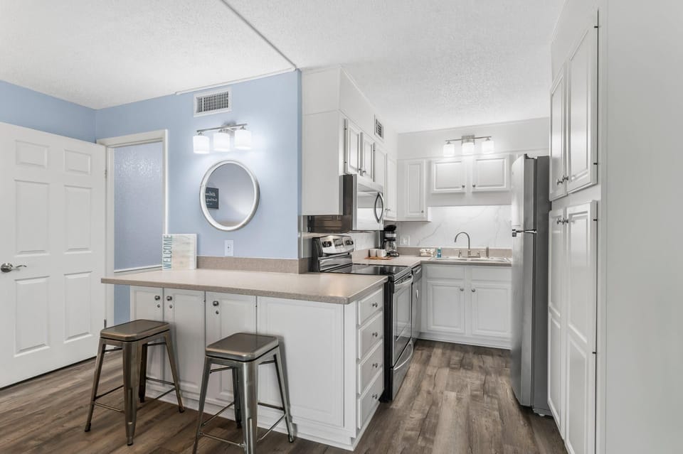 Condo, 1 King Bed with Sofa bed (The Summit 1031) | Private kitchen | Oven, stovetop, dishwasher, toaster