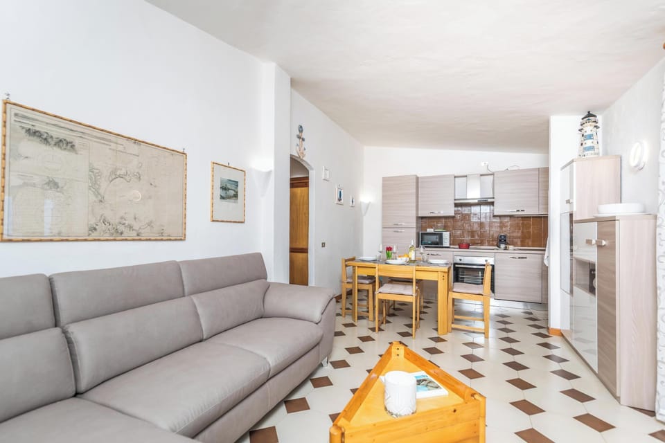 Family Apartment, Multiple Bedrooms (La Lampara House) | Living area | 21-inch flat-screen TV with cable channels