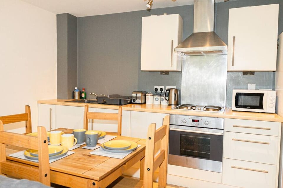 Comfort Apartment | Private kitchen | Full-size fridge, microwave, oven, stovetop