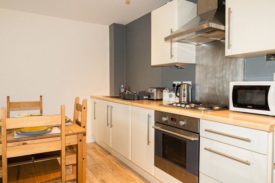 Comfort Apartment | Private kitchen | Full-size fridge, microwave, oven, stovetop