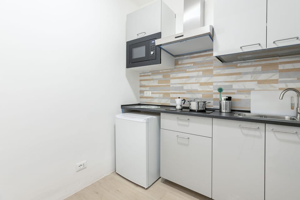 Comfort Apartment | Private kitchen | Microwave, espresso maker, cookware/dishes/utensils