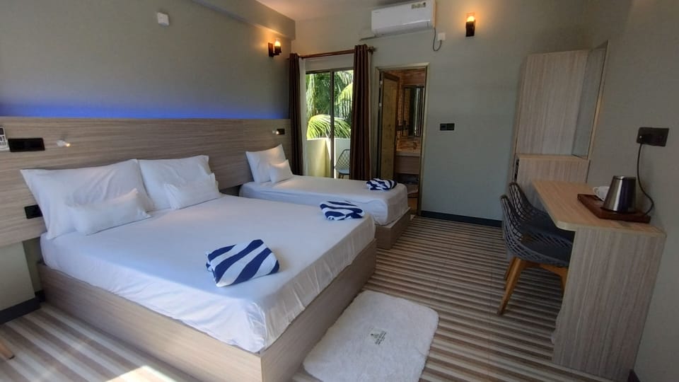 Deluxe Triple Room | Egyptian cotton sheets, premium bedding, Select Comfort beds, minibar