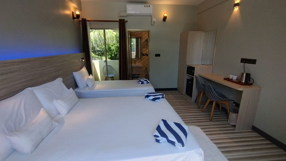 Deluxe Triple Room | Egyptian cotton sheets, premium bedding, Select Comfort beds, minibar