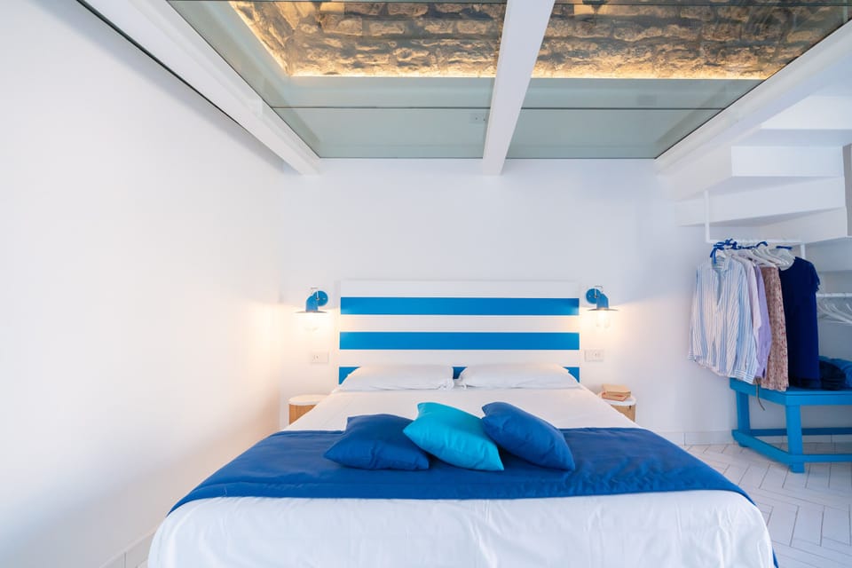 Deluxe Duplex | Premium bedding, down comforters, in-room safe, individually decorated