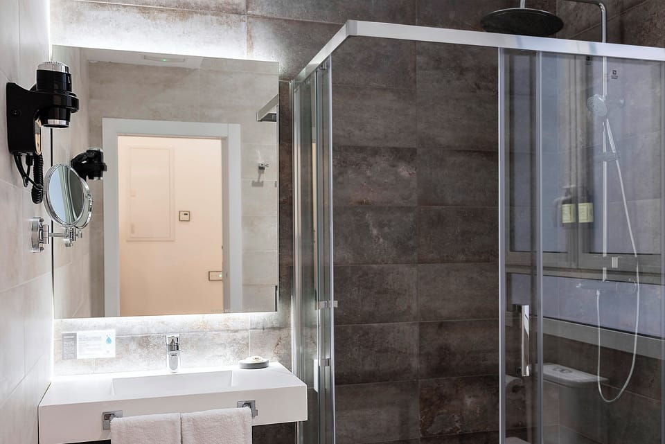 Family Suite, Balcony | Bathroom | Shower, hair dryer, towels, soap