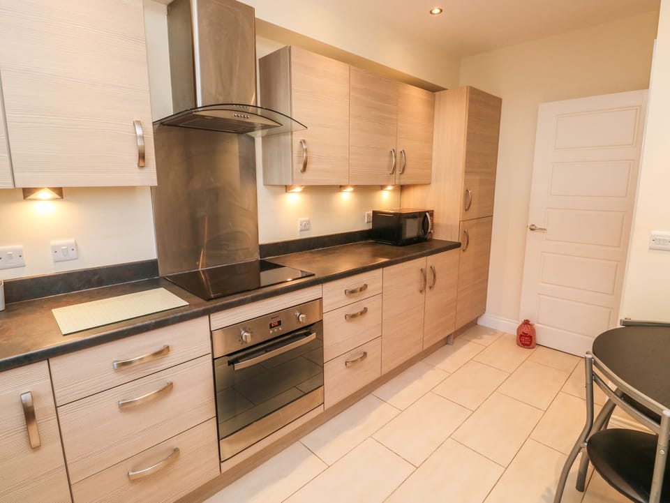 Fridge, electric kettle, toaster, cookware/dishes/utensils